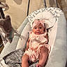 baby, infant, pink_headband, baby_rocker, cushion, plush_toy, smiling, cute, indoors, child, clothing, fabric, blanket, foot, head, person, resting, soft_toys, baby_girl, comfort