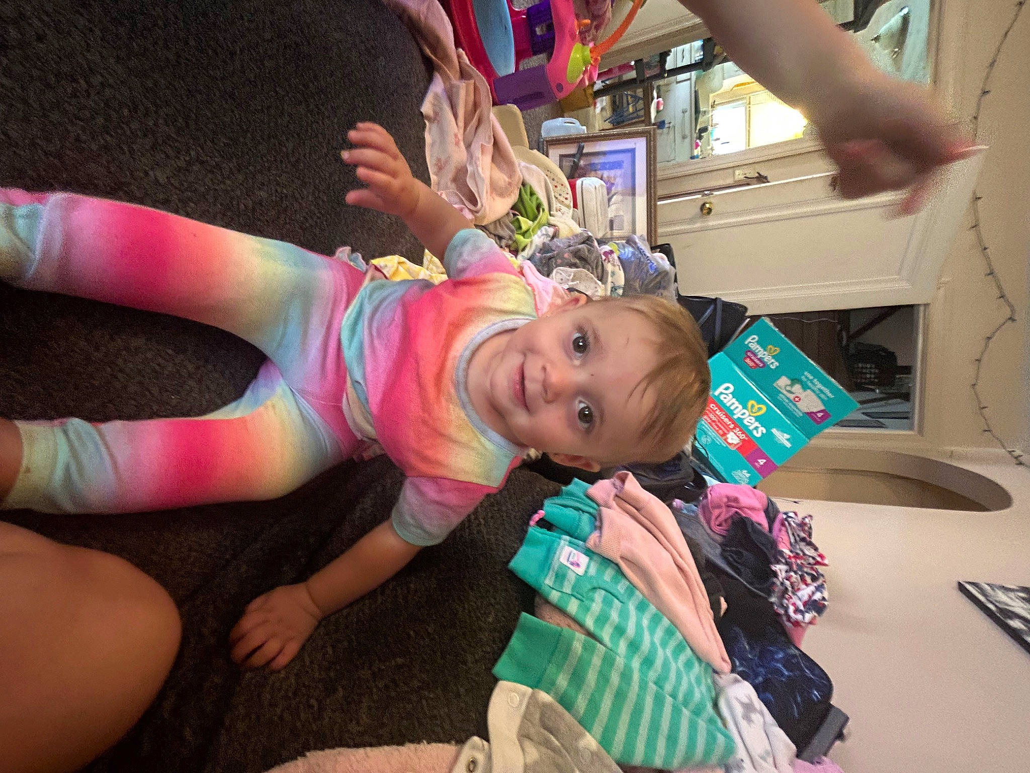 Callie is registered to the contest to win money with this photo: baby, baby_toddler_clothing, child, event, fun, happy, human_leg, joy, leisure, magenta, pattern, person, pink, room, smile, thigh, toddler