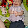 Aurora joined the competition — help win amazing prizes! baby, smiling, infant, child, clothing, play_mat, toy, colorful, happy, person, jeans, purple_shirt, hand_clasp, lying_down, indoor, cute, face, expression, playful, young