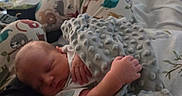 Kade joined the competition — help win amazing prizes! baby, newborn, sleeping, blanket, pillow, animal_print, bed, cozy, soft_texture, infant, hand, peaceful, resting, child, cute, indoors, comfort, closeup, family, toddler