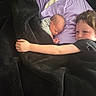 Kade is registered to the contest to win money with this photo: baby, child, sleeping, blanket, pillow, bed, cuddling, sibling, indoor, resting, comfort, black_blanket, purple_pillow, young_child, toddler, portrait, face, hand, cozy, nap