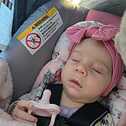 Sylvia joined the competition — help win amazing prizes! baby, sleeping, pacifier, headband, car_seat, blanket, child, infant, pink, clothing, seatbelt, resting, peaceful, cute, toddler, indoors, portrait, young_child, soft, comfort