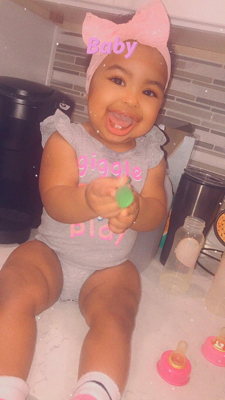 Aubrielle is registered to the contest to win money with this photo: abdomen, baby, baby_products, baby_toddler_clothing, bonnet, box, cheek, child, diaper, foot, headwear, home_appliance, joy, kitchen_appliance, party_supply, peach, person, pink, product, sock