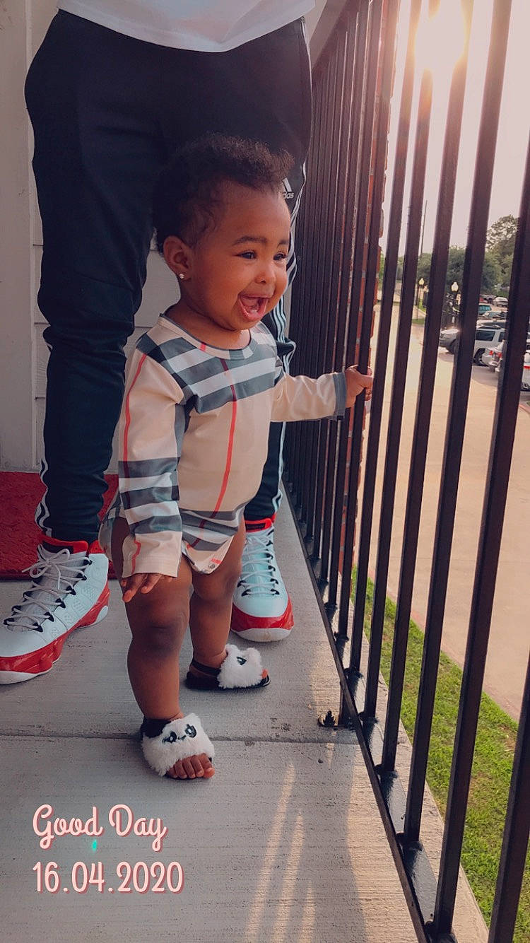 Aubrielle is registered to the contest to win money with this photo: ankle, athletic_shoe, baby, baby_toddler_clothing, calf, child, cool, fence, human_leg, iron, outdoor_shoe, person, product, shoe, skate_shoe, sneakers, sock, t_shirt, toddler, walking_shoe