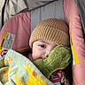 Jacob Enmanuel is registered to the contest to win money with this photo: baby, child, car_seat, blanket, pacifier, plush_toy, knit_hat, sleepy, indoor, comfort, cute, infant, resting, soft_toys, pink, green, warm, cozy, toddler, portrait
