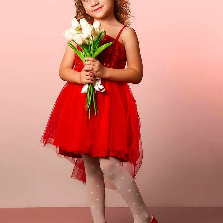 Rosa Nikol joined the competition — help win amazing prizes! child, girl, red_dress, crown, flowers, white_tulips, standing, portrait, smiling, curly_hair, stockings, red_shoes, pose, studio, pink_background, happy, cute, fashion, young, innocent