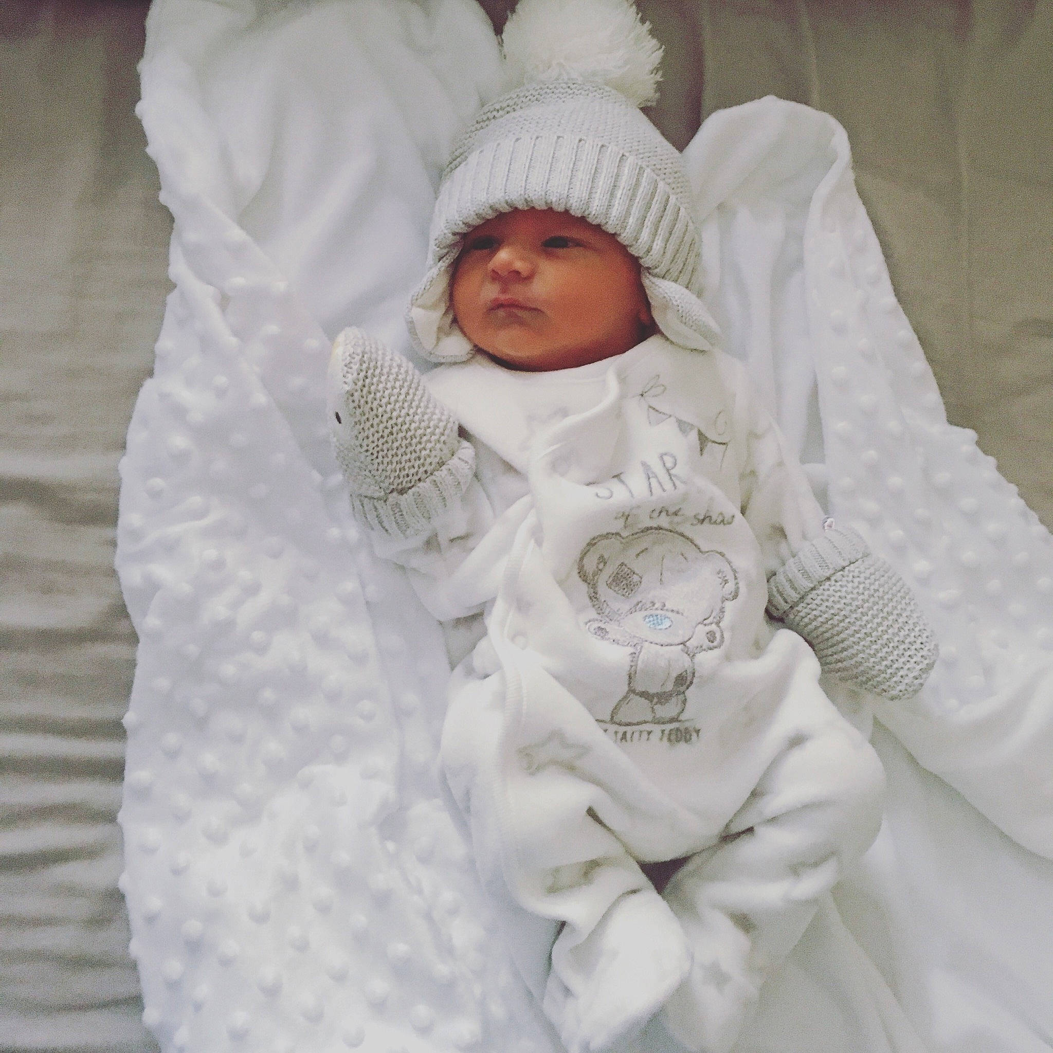 Alfie Stephen joined the competition — help win amazing prizes! bonnet, child, girl, headgear, headwear, infant, material, outerwear, person, product, textile, toddler, white, wool