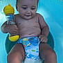 Noah a rejoint le concours — aidez-le/la à gagner de superbes lots ! toddler, child, baby, pool, water, toy, rattle, diaper, blue, wet_hair, sitting, smiling, outdoor, playtime, summer, skin, legs, hand, fun, childhood
