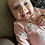 Carter joined the competition — help win amazing prizes! baby, infant, smiling, tongue_out, pink_onesie, panda_print, couch, textile, patterned_cushion, closeup, face, cheerful, happy, human, child, indoor, portrait, cute, skin, hand