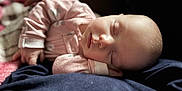 Carter is registered to the contest to win money with this photo: baby, sleeping, infant, pajamas, hand, face, peaceful, cozy, blanket, soft, resting, closeup, child, cute, indoors, portrait, newborn, calm, relaxation, skin