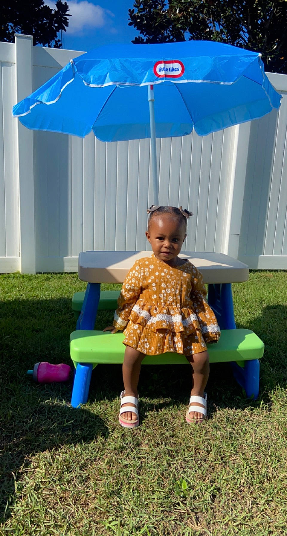 Kaitlynn joined the competition — help win amazing prizes! azure, baby_toddler_clothing, blue, child, electric_blue, fun, grass, lawn, leaf, leg, leisure, outdoor_furniture, person, public_space, recreation, sandal, shade, standing, summer, toddler