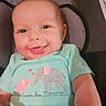 baby, smiling, infant, shirt, elephant, mint_green, clothing, car_seat, seat, child, cute, happy, face, portrait, arm, indoors, comfortable, young, baby_girl, baby_boy