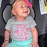 baby, infant, smiling, headband, pink, grey_shirt, car_seat, clothing, happy, child, cute, portrait, sitting, indoor, person, young, baby_clothes, expression, seat, comfort