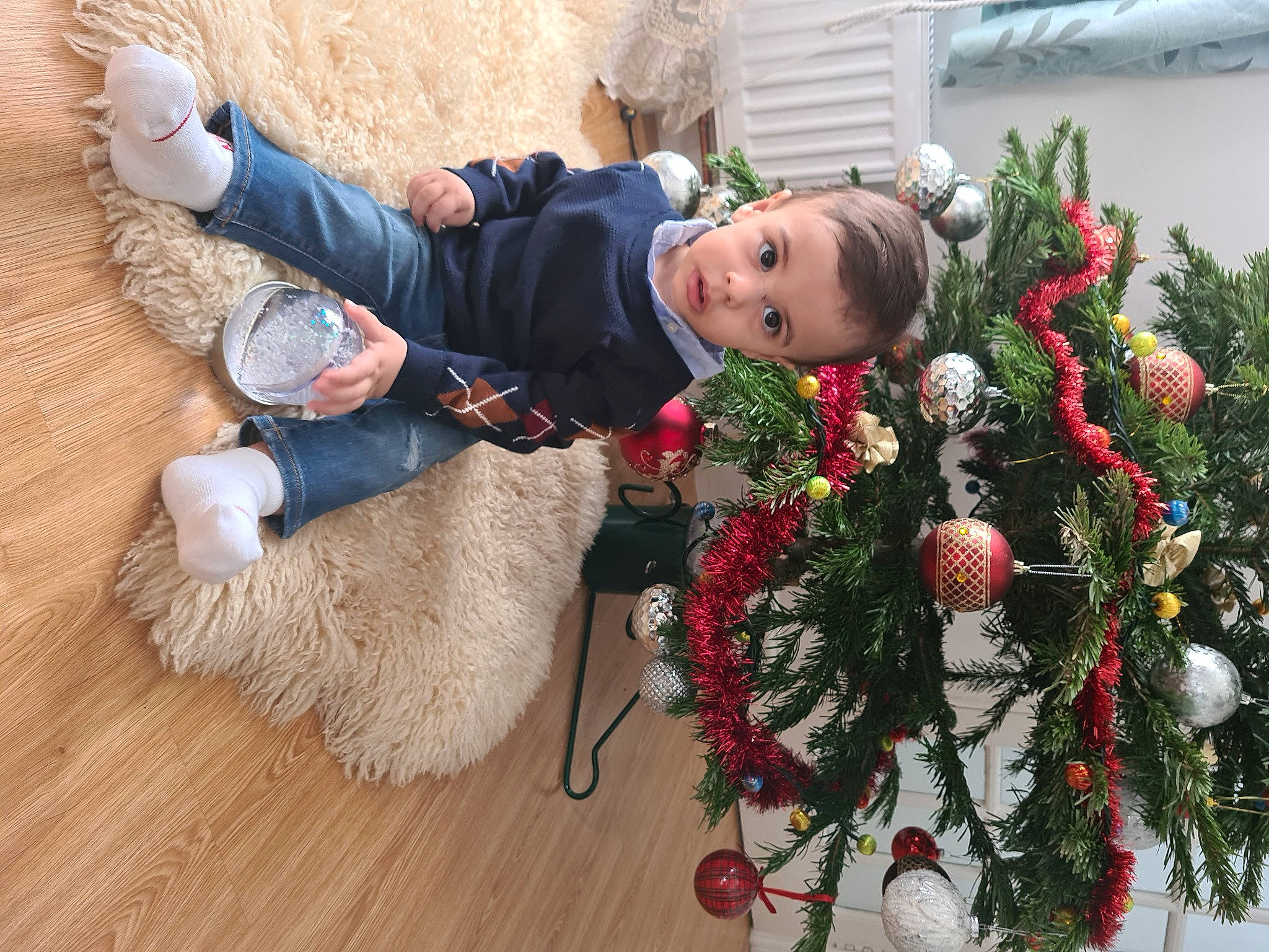 Andrei is registered to the contest to win money with this photo: boot, christmas, christmas_decoration, christmas_eve, christmas_ornament, conifer, costume_accessory, fur, glove, hardwood, holiday, holiday_ornament, human, interior_design, laminate_flooring, natural_material, ornament, person, pine_family, tradition