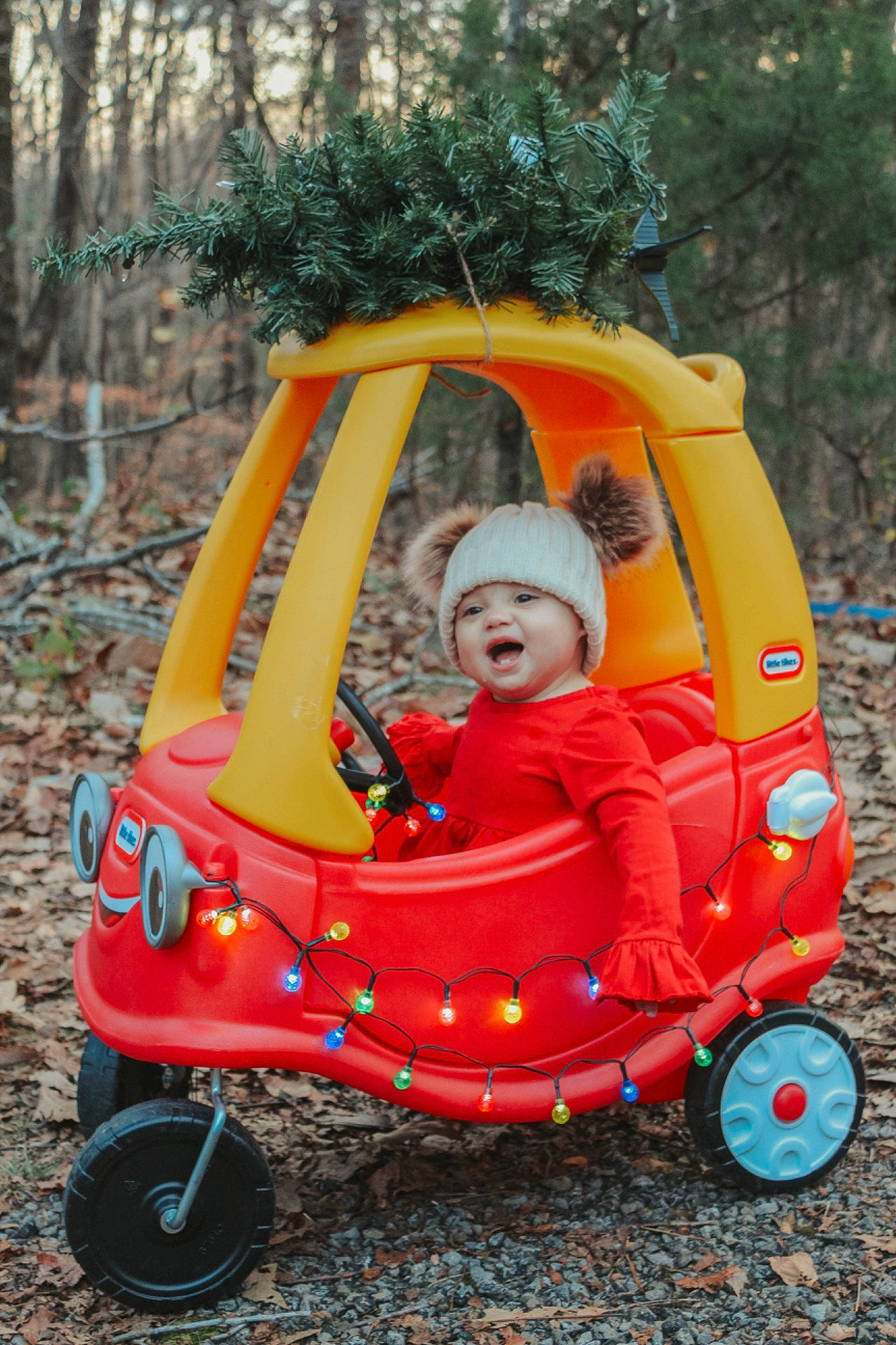 Ryleighann is registered to the contest to win money with this photo: automotive_design, automotive_wheel_system, baby, baby_carriage, baby_products, cart, child, grass, headwear, motor_vehicle, orange, person, plant, recreation, riding_toy, tire, toddler, toy, tree, vehicle