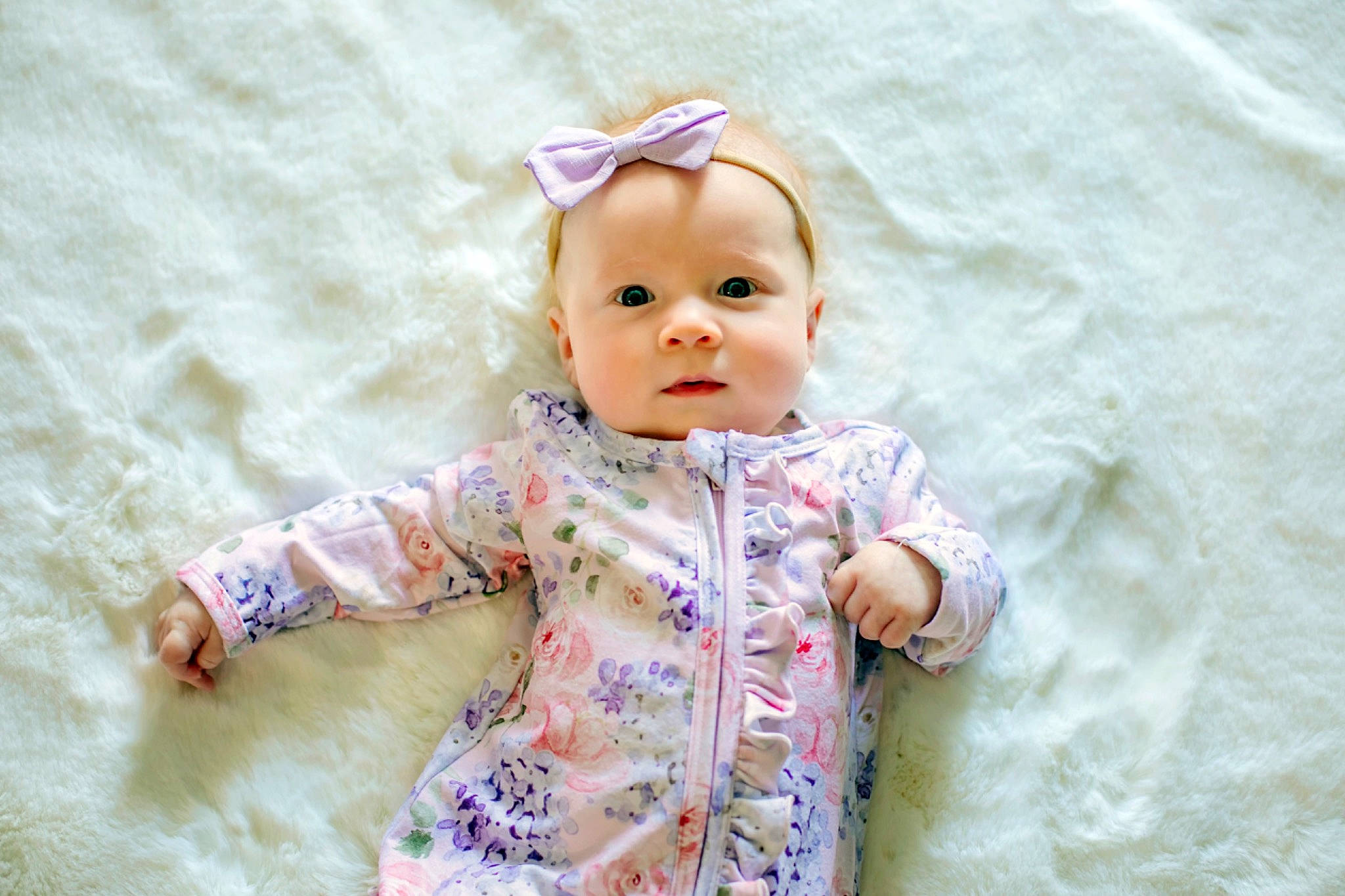 Emersyn is registered to the contest to win money with this photo: baby, baby_toddler_clothing, cheek, child, clothing, eye, face, fashion_accessory, flooring, fun, happy, head, iris, pattern, person, product, sitting, skin, sleeve, textile