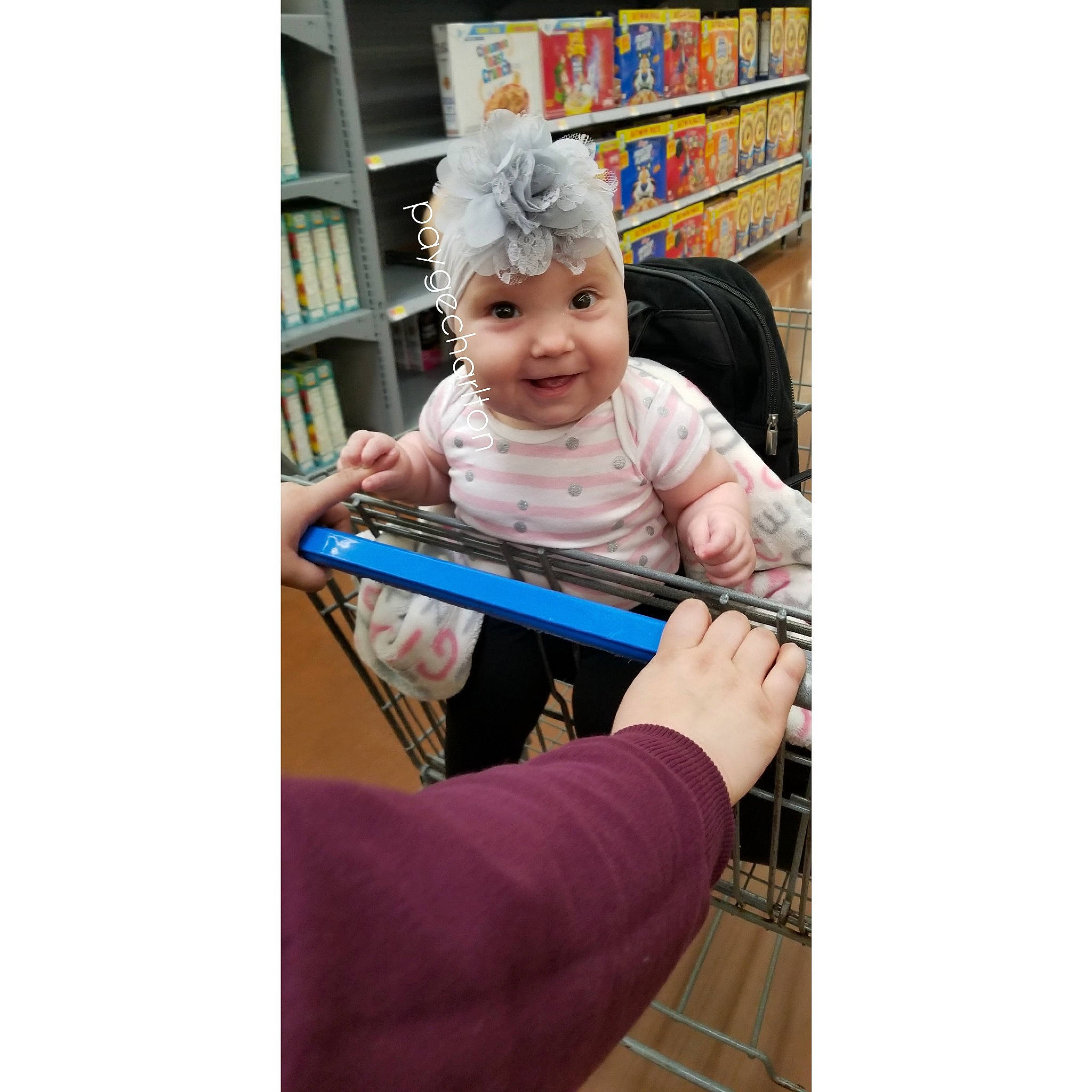 Eleanora is registered to the contest to win money with this photo: bookcase, child, furniture, hand, person, play, shelf, shelving, sitting, toddler