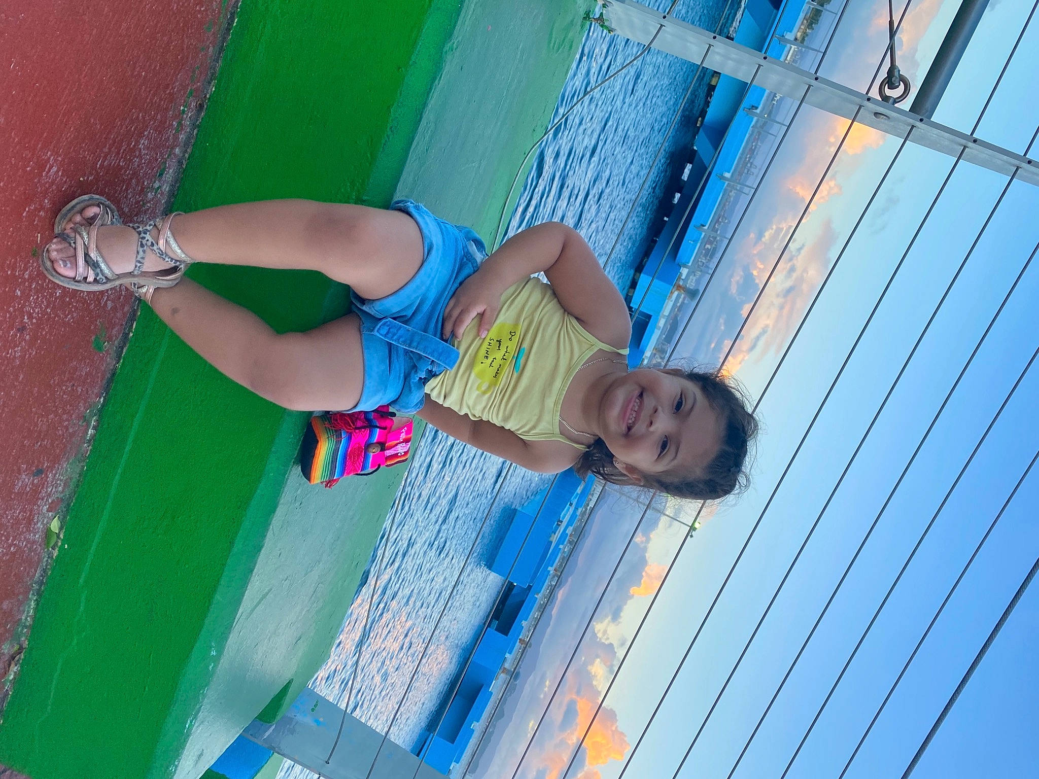 Alianna is registered to the contest to win money with this photo: azure, calf, child, electric_blue, foot, fun, happy, human_leg, joint, joy, knee, leisure, line, magenta, pattern, person, recreation, sky, smile, thigh