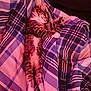 kitten, cat, sleeping, plaid_blanket, cozy, furry, indoor, pet, relaxed, cute, striped, tabby, paws, whiskers, fur, comfort, resting, bed, soft, nap