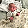Freddie is registered to the contest to win money with this photo: baby, sleeping, blanket, bed, pillow, infant, cute, soft, animal_print, hand, face, peaceful, newborn, clothing, comfort, rest, head, texture, indoors, portrait