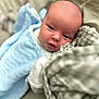 Freddie is registered to the contest to win money with this photo: baby, blanket, blue, bed, child, cozy, cute, face, infant, linen, looking, lying, person, portrait, resting, soft, texture, toddler, wrapped, young
