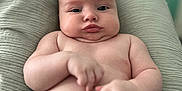 Freddie joined the competition — help win amazing prizes! baby, infant, child, skin, face, expression, pout, blanket, texture, hand, arm, naked, soft, green, comfort, portrait, indoors, cute, chubby, relaxed