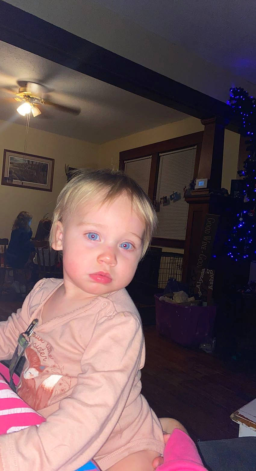 Haisley joined the competition — help win amazing prizes! baby, baby_toddler_clothing, ceiling_fan, chair, cheek, child, christmas_tree, couch, event, flooring, fun, iris, living_room, mechanical_fan, person, picture_frame, room, sitting, standing, toddler