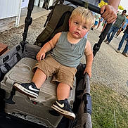 Asa joined the competition — help win amazing prizes! toddler, child, stroller, cooler, outdoor, people, adult, casual_clothing, shorts, tank_top, sneakers, grass, pavement, hand, walking, sunny, daytime, event, person, background
