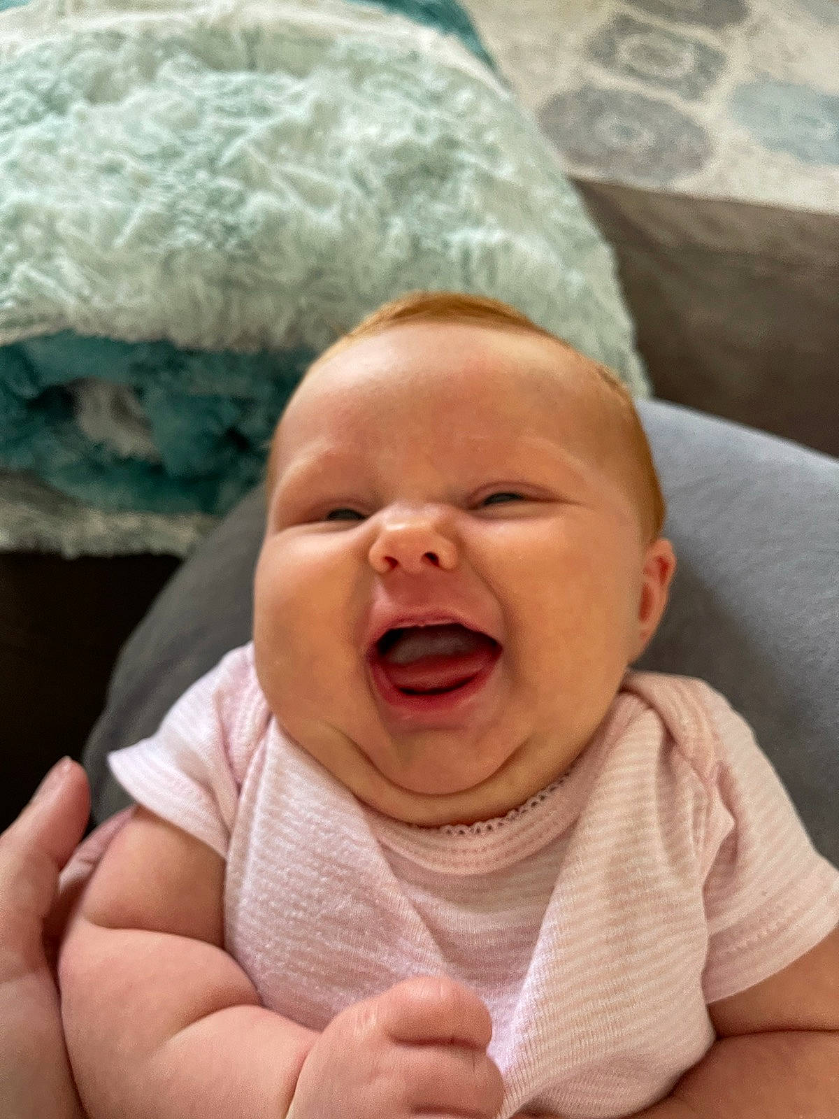 Andi is registered to the contest to win money with this photo: baby, baby_toddler_clothing, cheek, child, chin, comfort, eye, finger, fun, gesture, happy, lip, mouth, nose, person, skin, smile, thumb, toddler, tooth