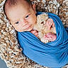 baby, newborn, infant, blue_swaddle, plush_toy, teddy_bear, blanket, soft_texture, cozy, resting, cute, small_hands, small_feet, face, head, sleepy, indoor, portrait, child, wrapped