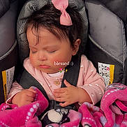 Aileen is registered to the contest to win money with this photo: baby, infant, sleeping, car_seat, pink_bow, blanket, pink_blanket, child, cute, peaceful, strapped_in, clothing, indoors, seatbelt, soft_texture, adorable, face, young_child, resting, portrait