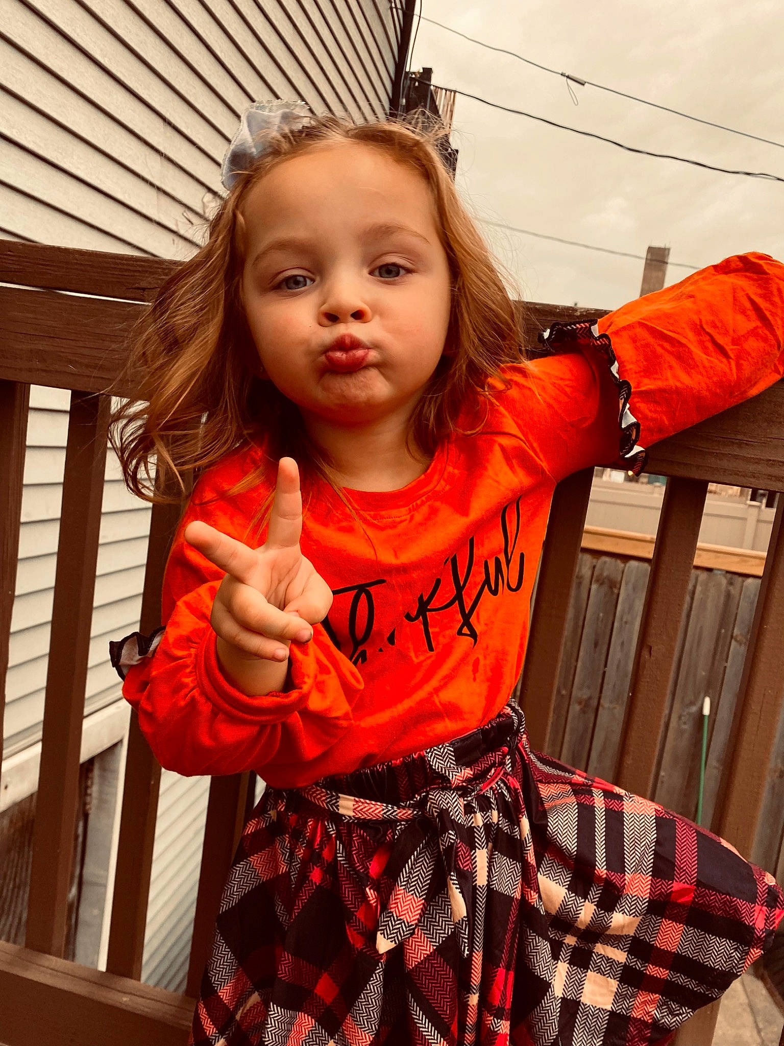 Kelsey joined the competition — help win amazing prizes! baby_toddler_clothing, beauty, child, facial_expression, fashion, fun, gesture, hair, hairstyle, happy, human, orange, people, person, plaid, red, sleeve, standing, tartan, toddler