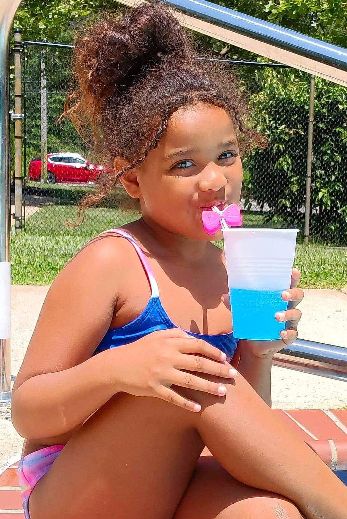 Skylynn is registered to the contest to win money with this photo: brassiere, chest, child, fun, human_leg, leisure, lingerie_top, one_piece_swimsuit, person, plant, recreation, smile, summer, swimsuit_bottom, swimsuit_top, swimwear, thigh, toddler, undergarment, underpants