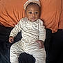 Carter is registered to the contest to win money with this photo: baby, bed, blanket, child, comfortable, cute, face, foot, hand, hat, indoors, infant, lying_down, pajamas, person, pillow, skin, sleepwear, striped_clothing, wide_eyes