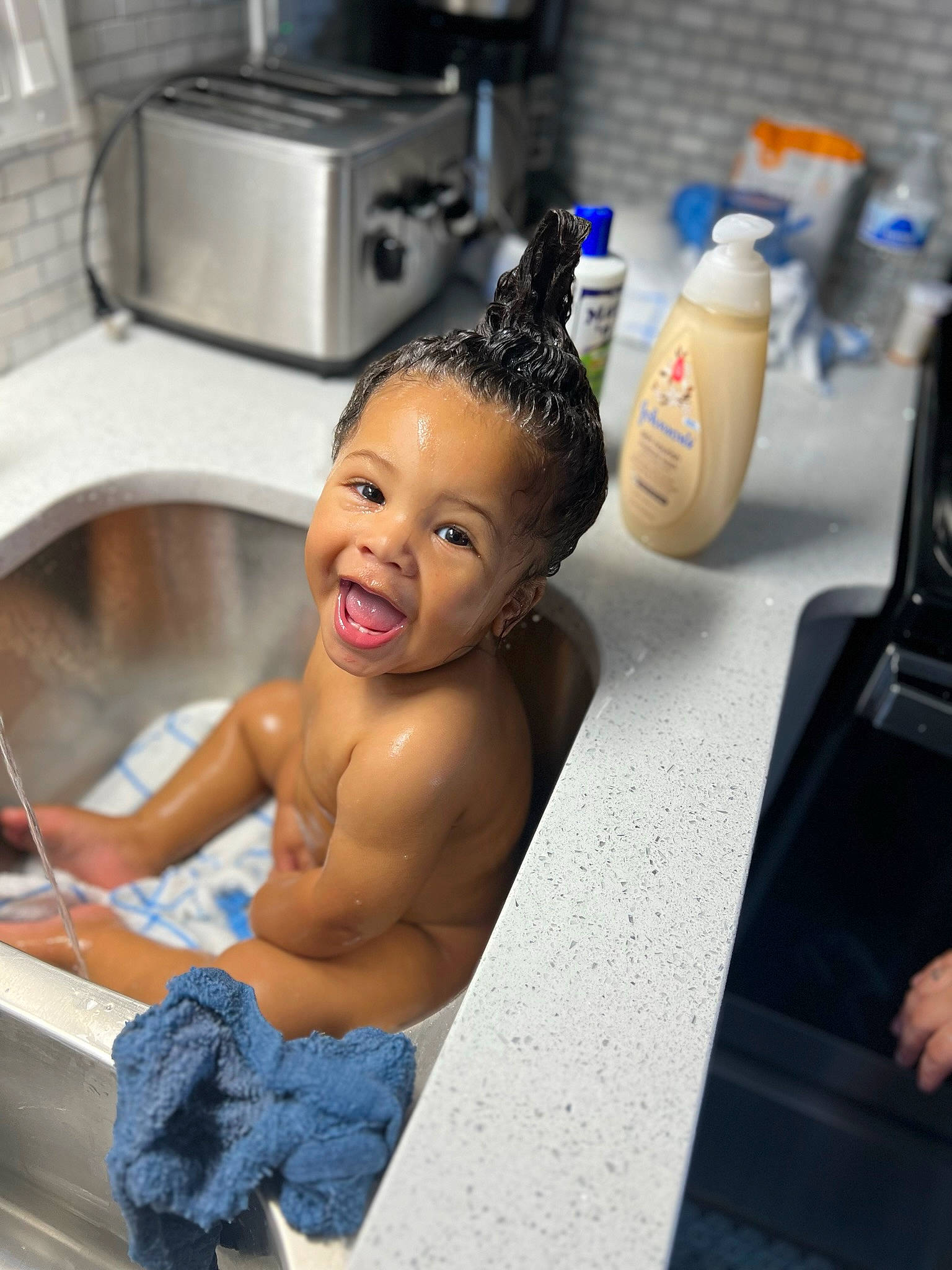 Isaiah is registered to the contest to win money with this photo: bathing, chest, cooktop, countertop, eyelash, flooring, gas, gas_stove, happy, home_appliance, kitchen, kitchen_appliance, kitchen_stove, person, plumbing, plumbing_fixture, room, smile, stove, tap
