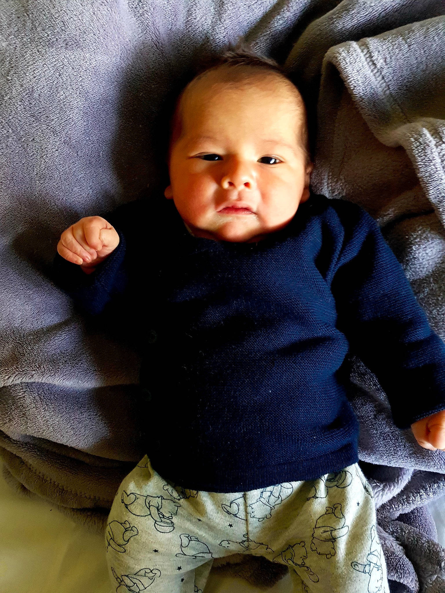 Tiyam participe au concours pour gagner de l'argent avec cette photo : azure, baby, baby_toddler_clothing, cheek, child, comfort, eye, iris, leg, linens, outerwear, pattern, person, product, sitting, skin, sleeve, textile, toddler, trunk