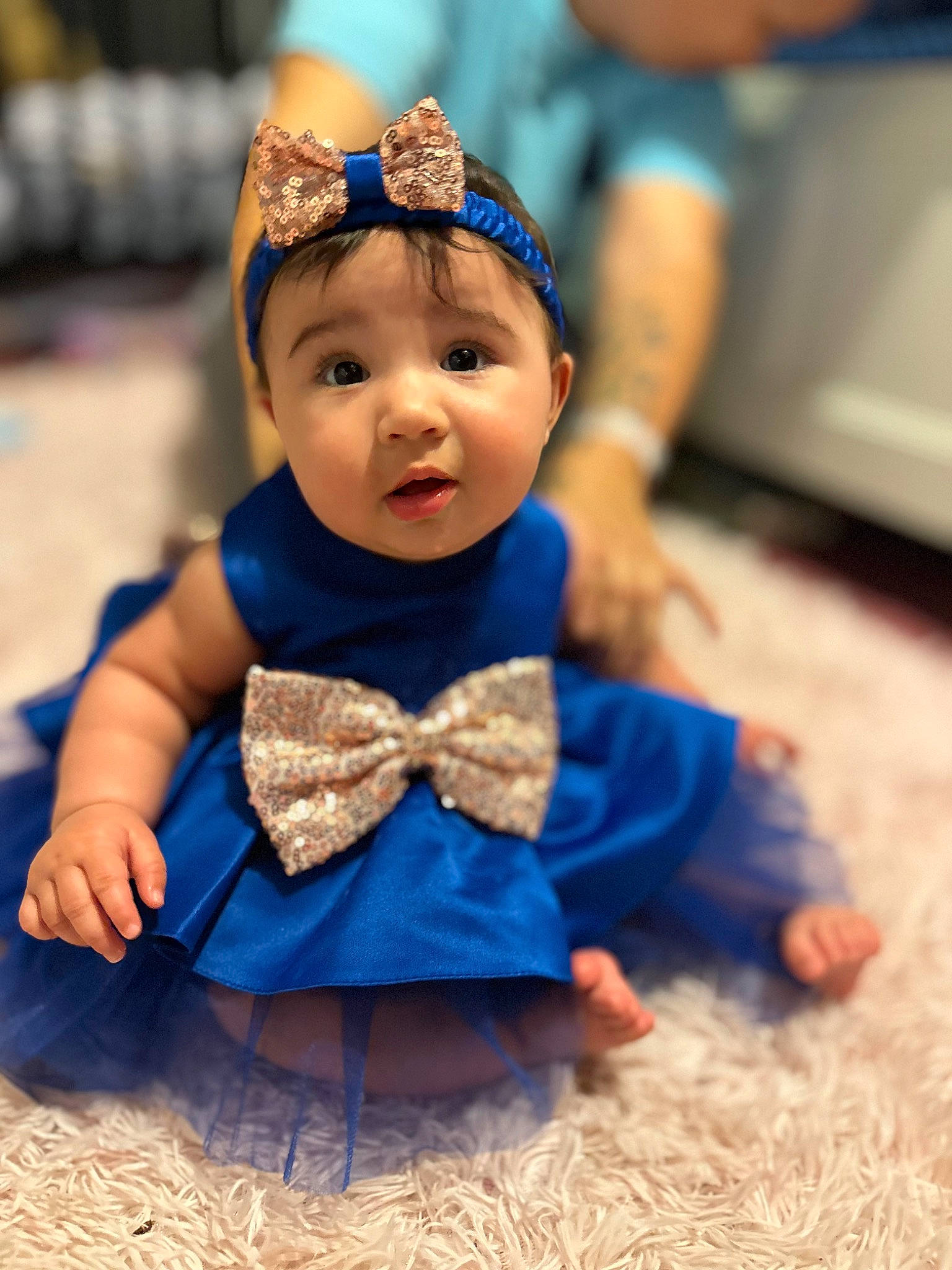 Zariyah joined the competition — help win amazing prizes! baby, baby_toddler_clothing, child, crown, doll, dress, electric_blue, event, fashion_accessory, fun, happy, hat, headband, headpiece, headwear, jewellery, person, sitting, surprise, tiara