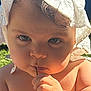 Hailey participe au concours pour gagner de l'argent avec cette photo : baby, chewing, child, closeup, cute, daylight, expression, face, hand, hat, infant, outdoor, portrait, shadow, skin, string, summer, sun_hat, sunlight, young