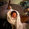 newborn, baby, sleeping, infant, blanket, swaddled, face, portrait, adult, foot, bed, bedroom, home, indoors, cozy, white_blanket, dark_hair, peaceful, family, photography