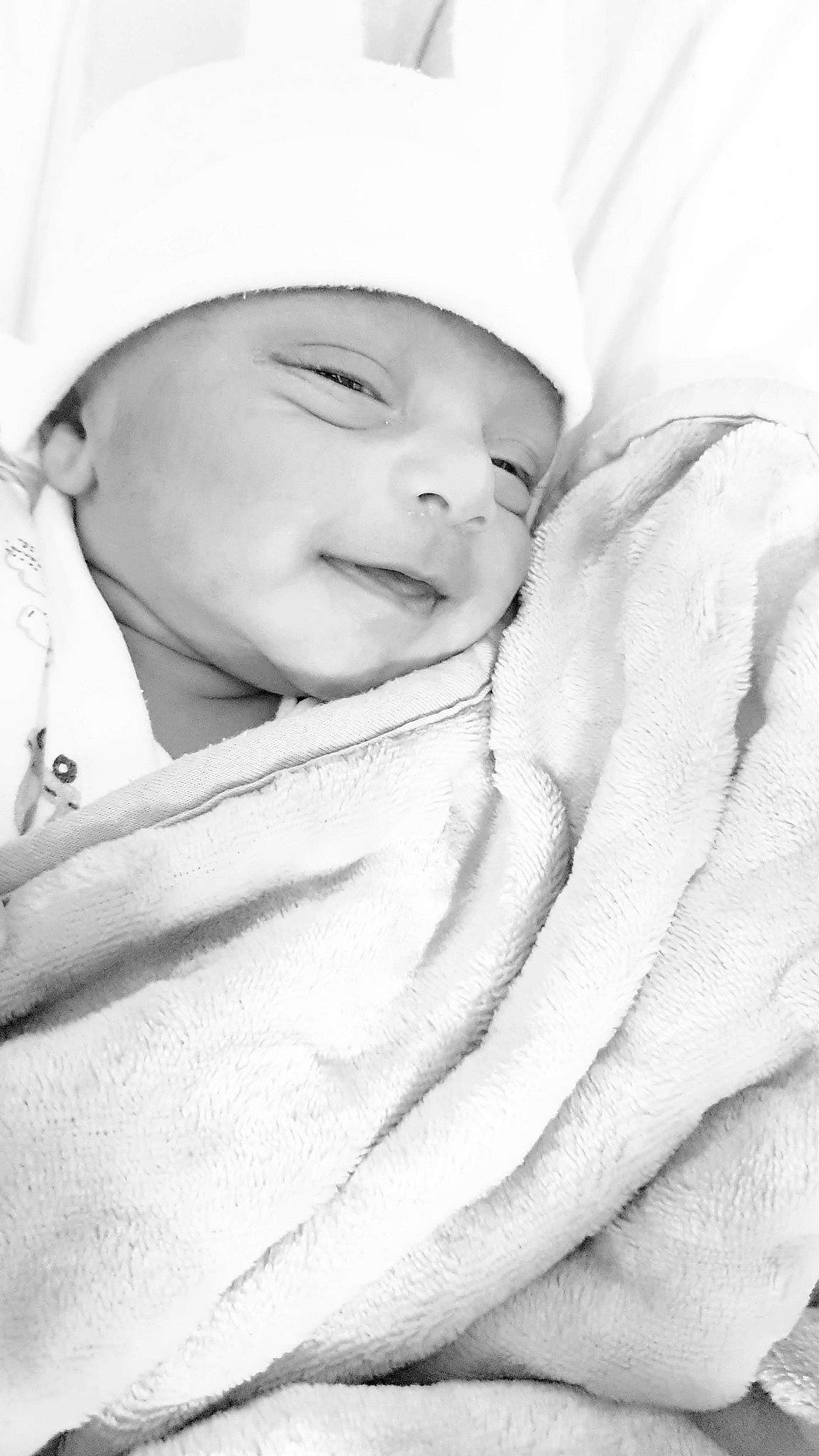 Hassan is registered to the contest to win money with this photo: baby, beauty, bedtime, black_and_white, cheek, child, face, head, headwear, linens, lip, monochrome, monochrome_photography, nose, person, photograph, photography, portrait, portrait_photography, skin