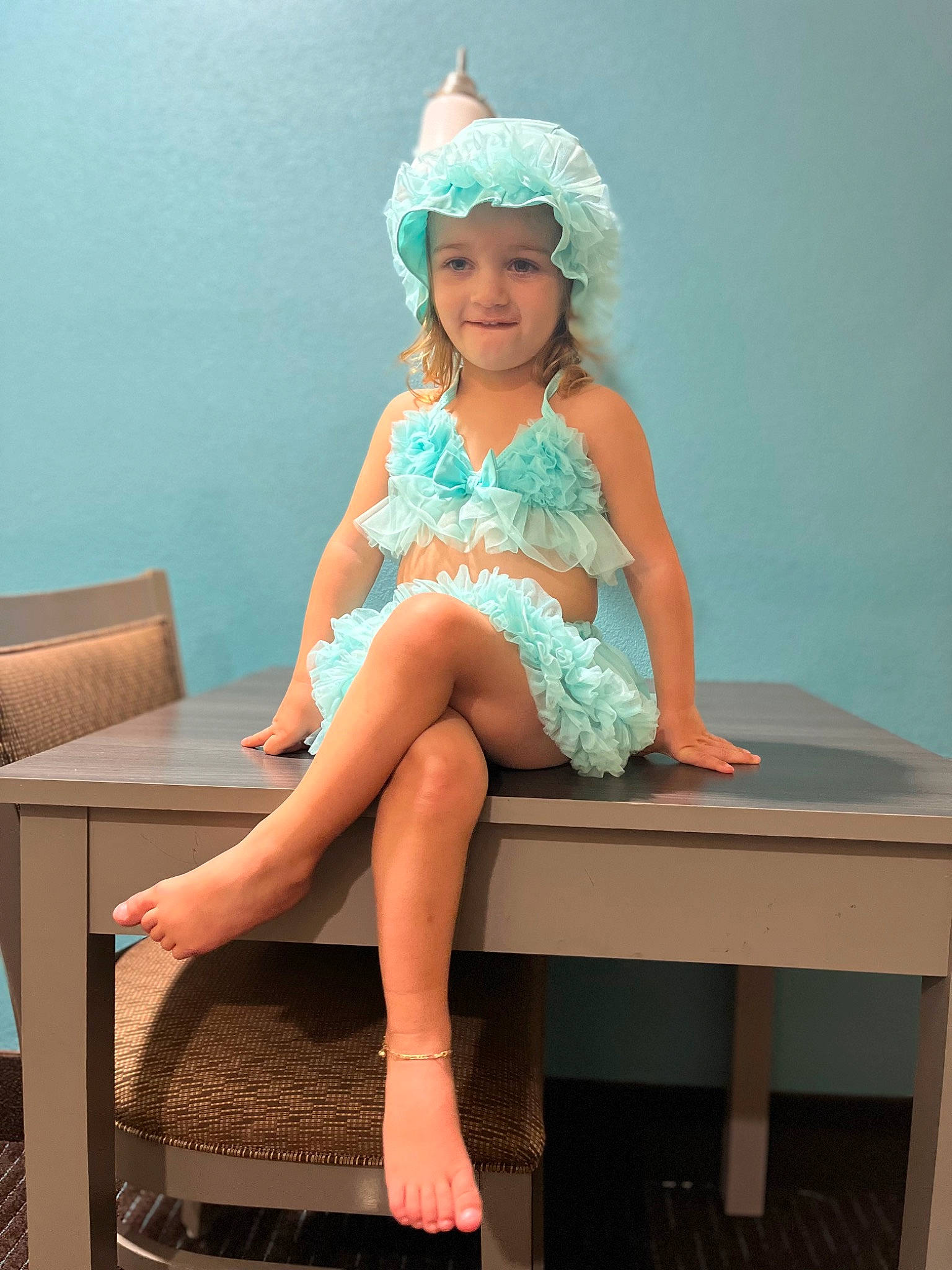 Martha is registered to the contest to win money with this photo: day_dress, dress, electric_blue, face, fashion_design, finger, furniture, happy, headwear, human_leg, joint, joy, knee, leg, long_hair, neck, person, pink, sandal, sleeve