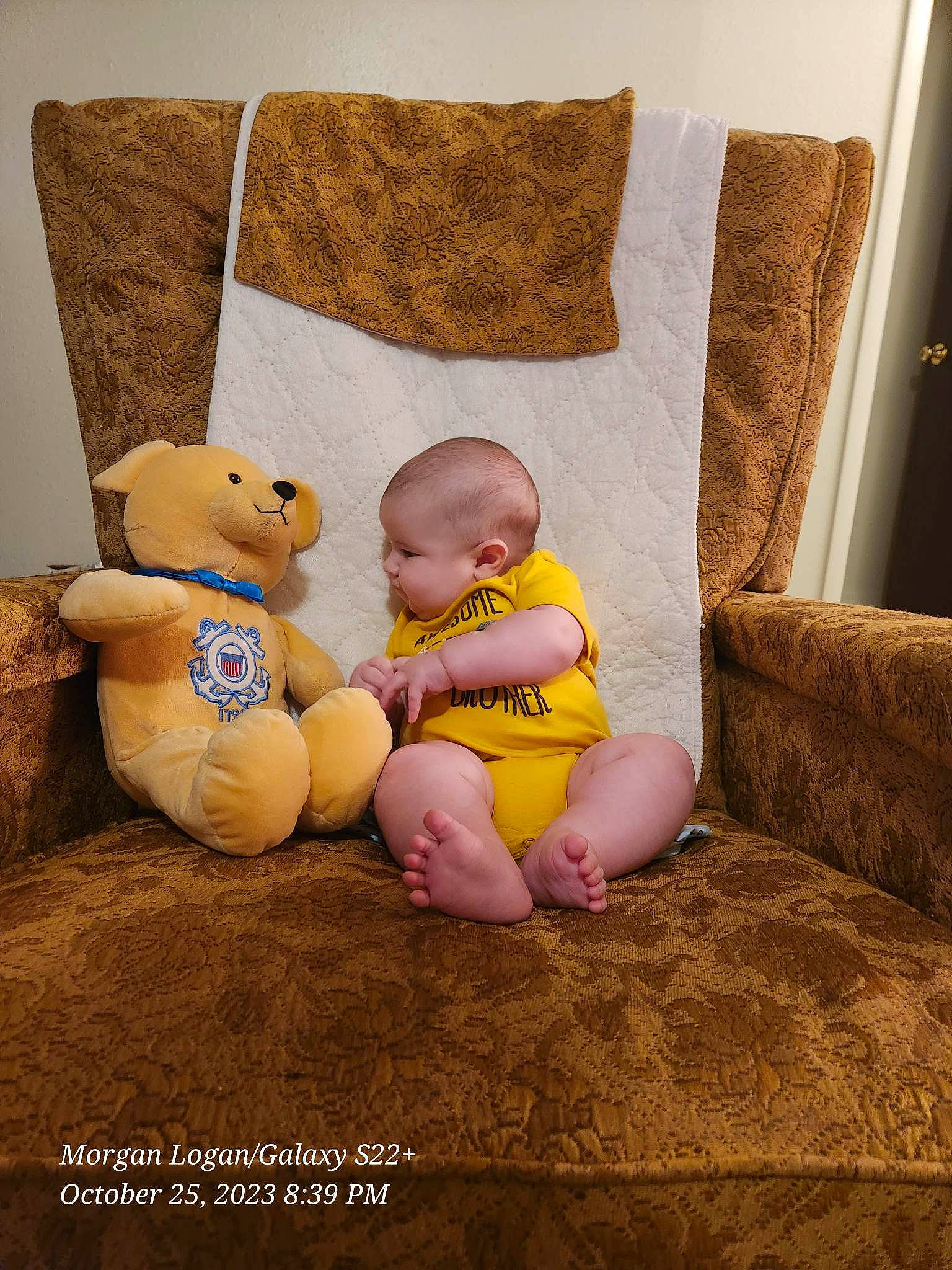 Ocean is registered to the contest to win money with this photo: baby, baby_sleeping, bedding, chair, child, comfort, couch, flooring, happy, linens, person, pillow, room, sitting, stuffed_toy, teddy_bear, textile, throw_pillow, toddler, toy