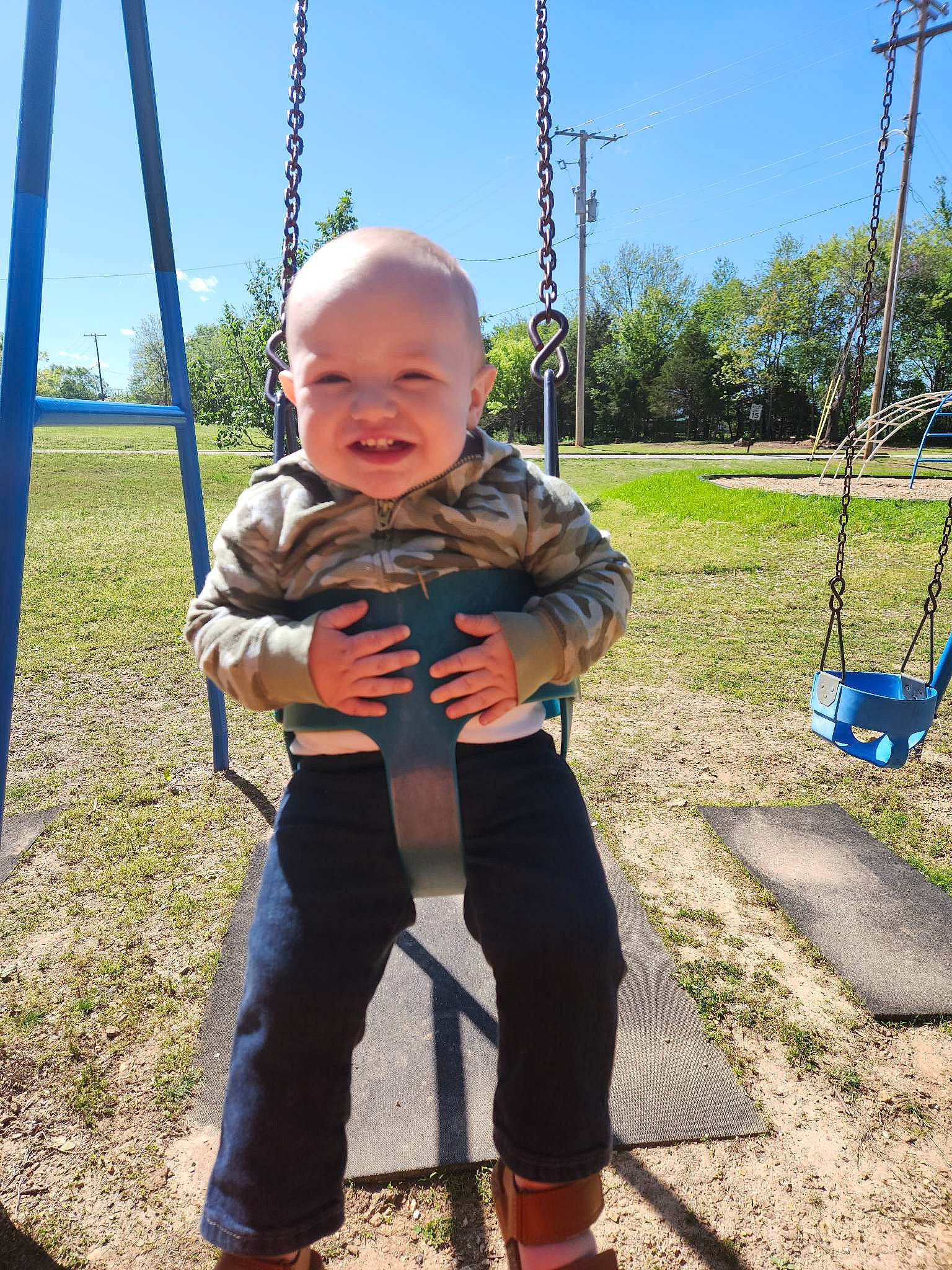 Deuteronomy joined the competition — help win amazing prizes! baby, baby_toddler_clothing, blue, child, city, electric_blue, fun, grass, happy, leisure, outdoor_play_equipment, people_in_nature, person, plant, playground, recreation, sky, smile, swing, toddler