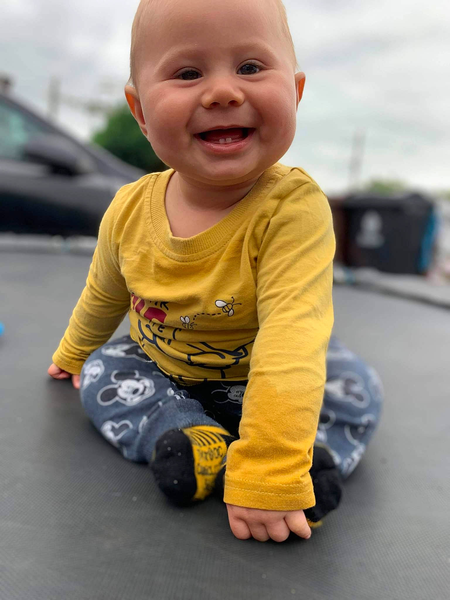 Jesse-james is registered to the contest to win money with this photo: asphalt, baby, baby_toddler_clothing, cheek, child, cloud, crawling, face, flooring, fun, grass, happy, head, joy, nose, person, road_surface, skin, sky, smile