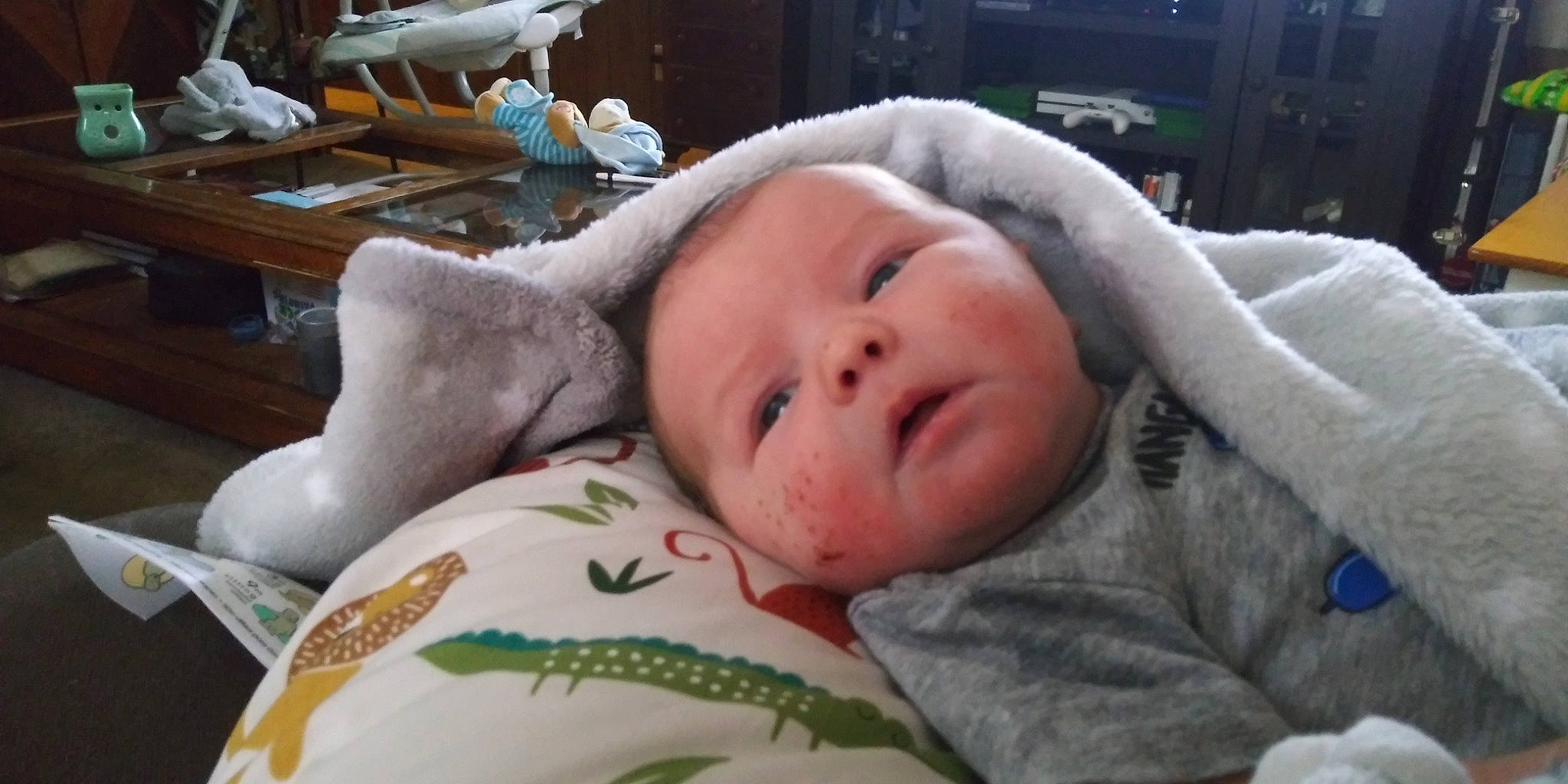 Clinton is registered to the contest to win money with this photo: baby, baby_toddler_clothing, cheek, child, comfort, eye, eyebrow, eyelash, fur, linens, lip, mouth, nose, person, room, skin, sleep, textile, toddler, vertebrate