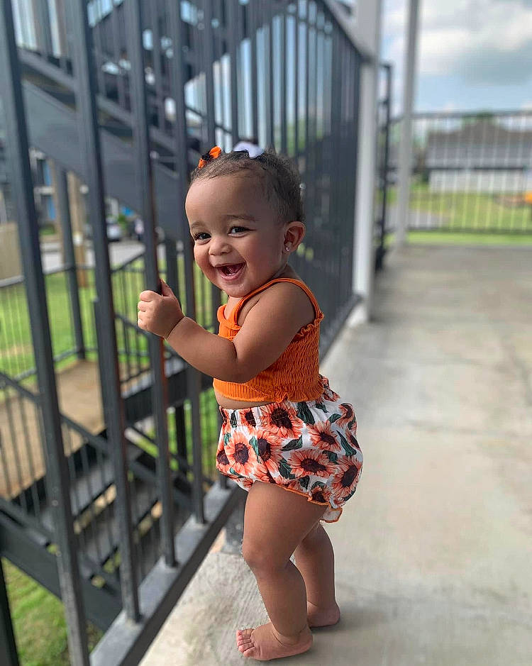 Tru joined the competition — help win amazing prizes! baby_toddler_clothing, child, eye, fence, foot, fun, grass, hair, happy, human_leg, joy, leisure, pattern, person, skin, sky, smile, summer, thigh, toddler