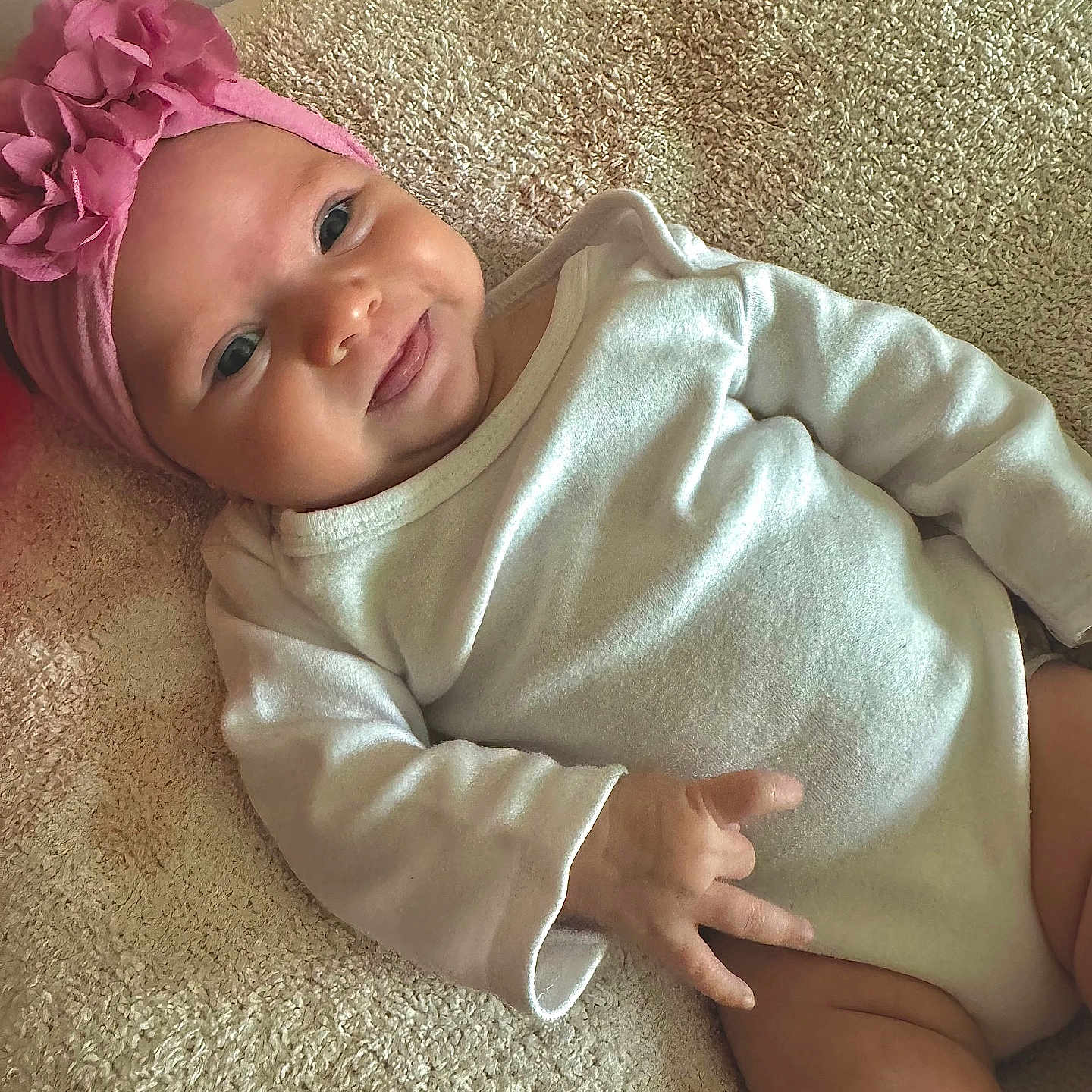 Ariella is registered to the contest to win money with this photo: accessories, baby, babylaughing, blanket, bonnet, cap, clothing, cushion, face, happy, hat, head, headband, newborn, person, photography, portrait, sitting, sleeve, smile