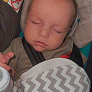Grayson joined the competition — help win amazing prizes! baby, blanket, car_seat, child, closeup, clothing, face, hand, head, indoors, infant, pattern, peaceful, portrait, seatbelt, sleeping, soft_lighting, timestamp, vintage_style, zigzag