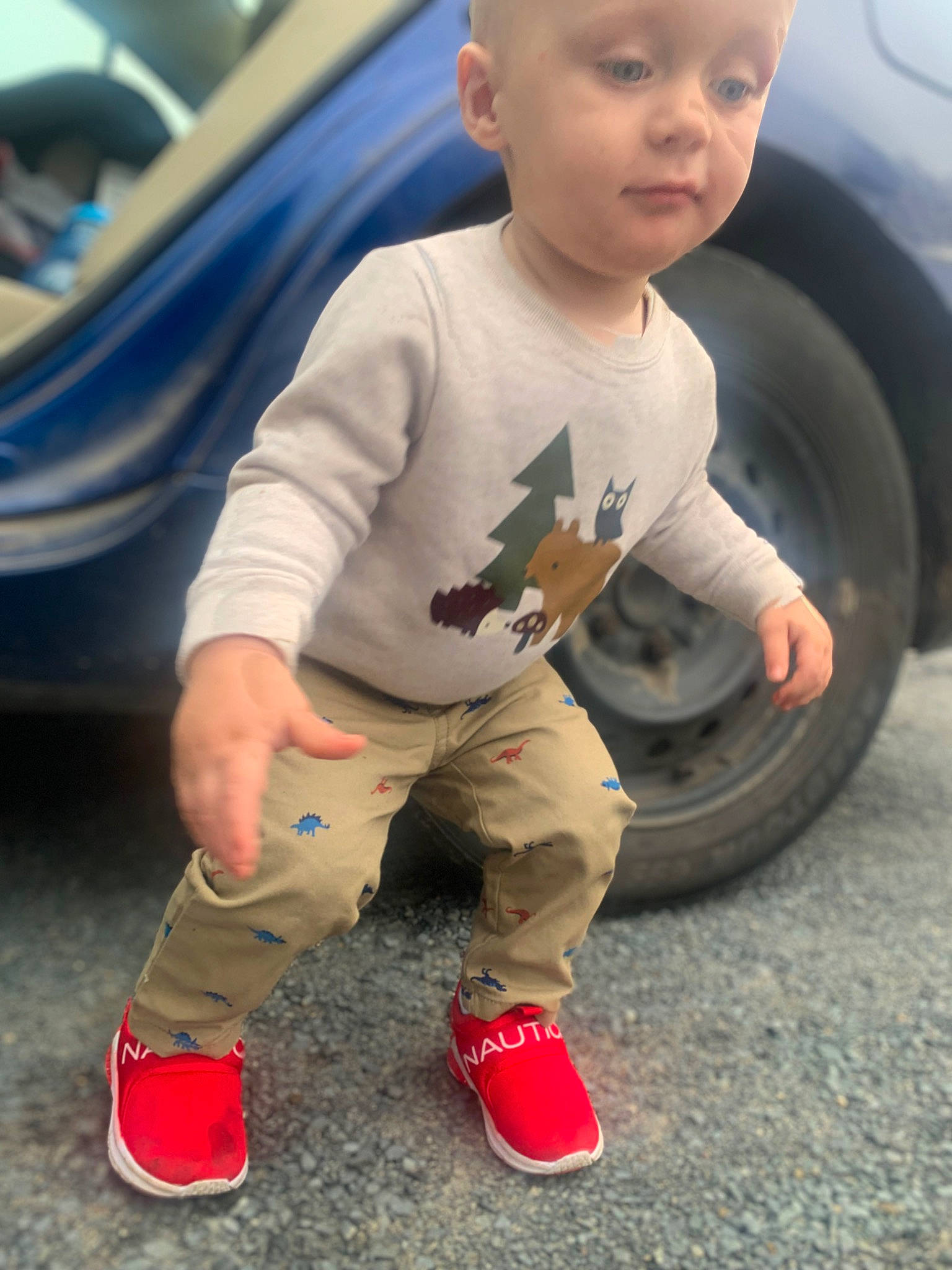 Jaxson is registered to the contest to win money with this photo: asphalt, automotive_design, automotive_exterior, automotive_tire, bumper, car, child, cool, electric_blue, human_leg, knee, motor_vehicle, person, shoe, sneakers, thigh, tire, toddler, vehicle, vehicle_door