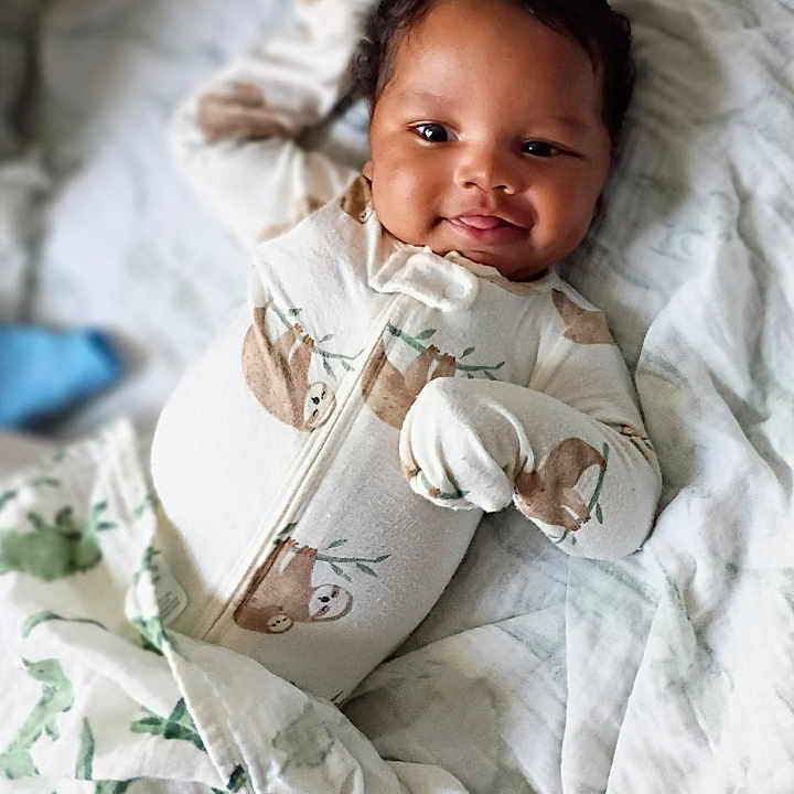Kyro joined the competition — help win amazing prizes! baby, infant, child, smiling, portrait, lying_down, blanket, bed, bedding, onesie, mittens, nursery, indoor, cozy, happy, face, eyes, hair, candid, photography